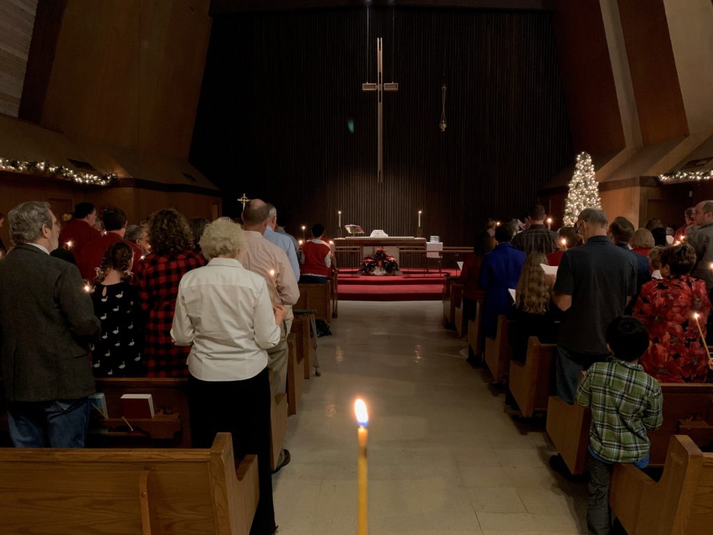 congregation in sanctuary singing silent night